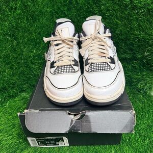 Air Jordan 4 Retro White and Black Sneakers